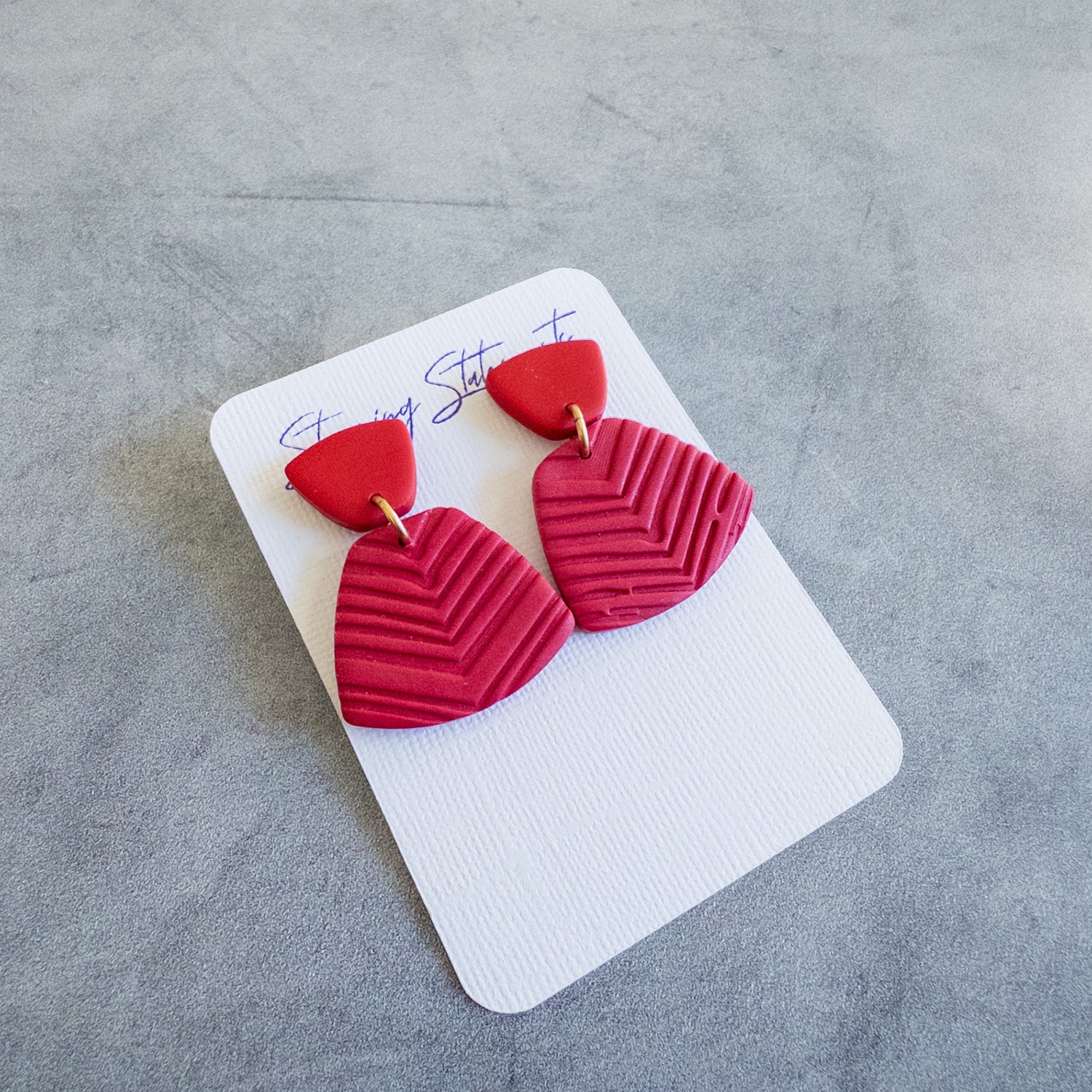 stunning statements fan clay textured statement red blake earrings