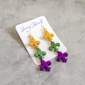 stunning statements clay mardi gras dangle lightweight large big statement glitter shiny purple green gold fleur de lis earrings