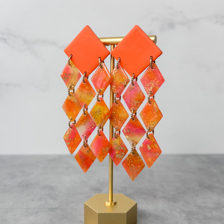 stunning statements bold oversized colorful bright orange yellow pink statement clay earrings